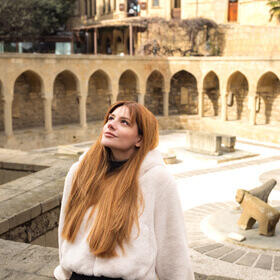 Woman in the square near Haji Gayib Bathhouse in Baku Old City during a photo tour
